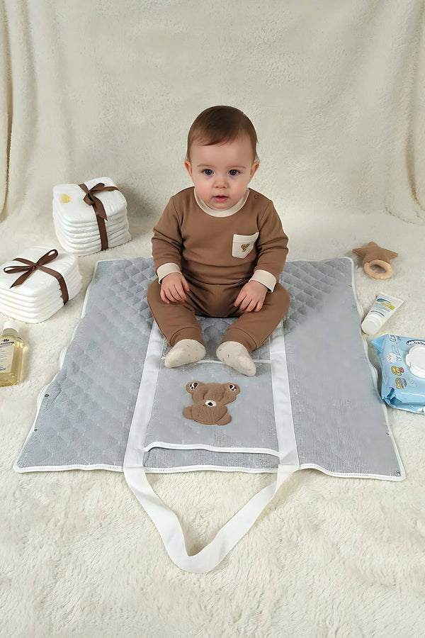 Mehrzweck-Pflegetasche und Wickelunterlage mit Teddybär-Motiv