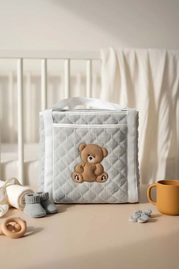 Mehrzweck-Pflegetasche und Wickelunterlage mit Teddybär-Motiv
