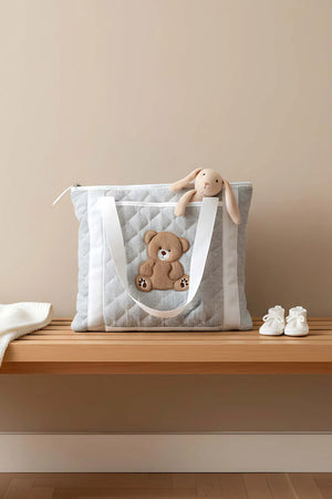 Mehrzweck-Pflegetasche und Wickelunterlage mit Teddybär-Motiv