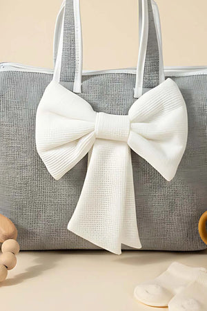 Wickeltasche mit Schleife und weißem Band für Mutter und Baby