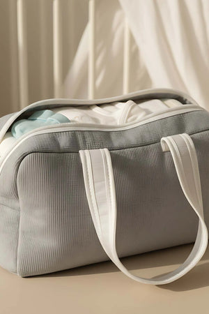 Wickeltasche mit Schleife und weißem Band für Mutter und Baby