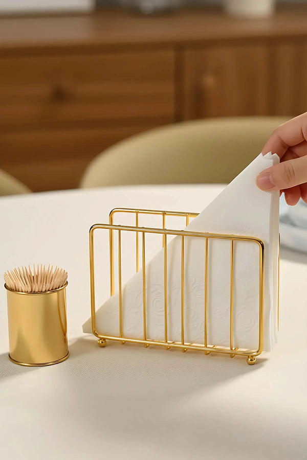 Goldener Serviettenhalter aus Metall in Käfigform
