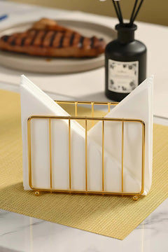 Goldener Serviettenhalter aus Metall in Käfigform