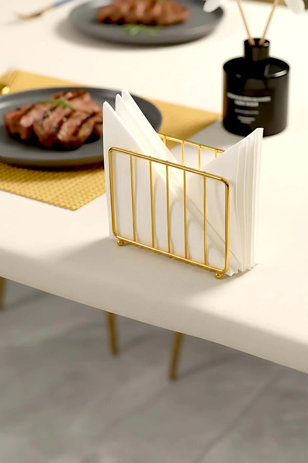 Goldener Serviettenhalter aus Metall in Käfigform