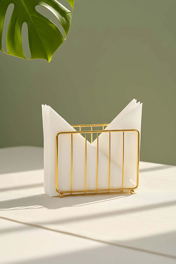 Goldener Serviettenhalter aus Metall in Käfigform